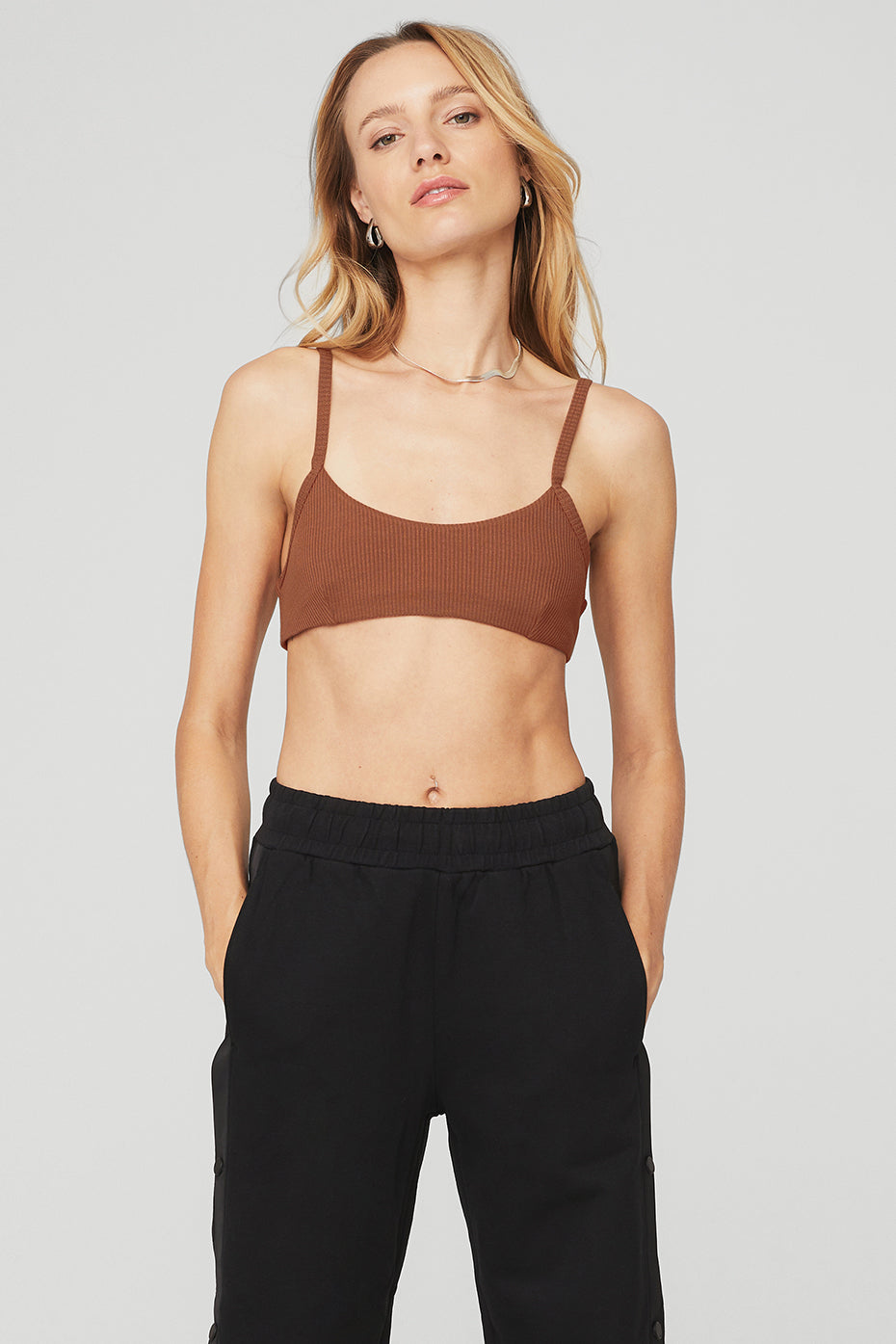 Ribbed Manifest Bra in Rust by Alo Yoga